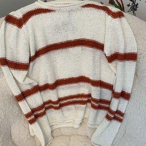 White and orange striped knitted sweater